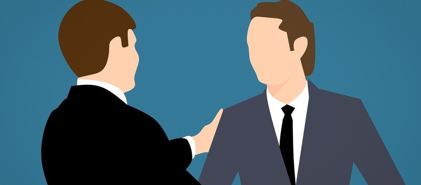 Eine Illustration zeigt zwei Männer im Anzug, die sich die Hände schütteln.